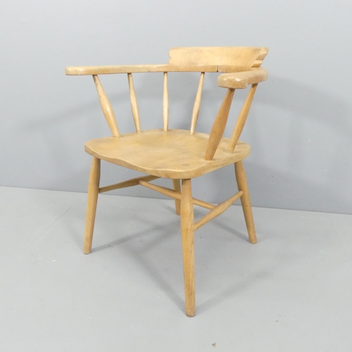 2015 - A mid-century light elm bow-arm Captain's chair.