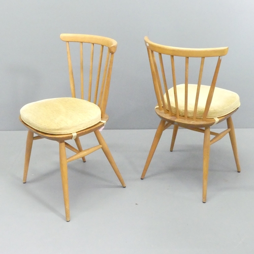 2017 - ERCOL - A mid-century set of four elm and beech model 449 bow top Windsor dining chairs