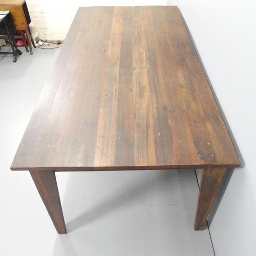 2025 - HASTINGS PIER INTEREST - A stained teak plank-top dining table, constructed from timber salvaged fro... 