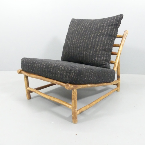 2034 - A mid-century style Brutalist lounge chair by Rock the Kasbah, with maker's label.