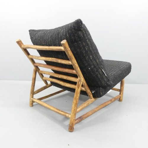 2034 - A mid-century style Brutalist lounge chair by Rock the Kasbah, with maker's label.