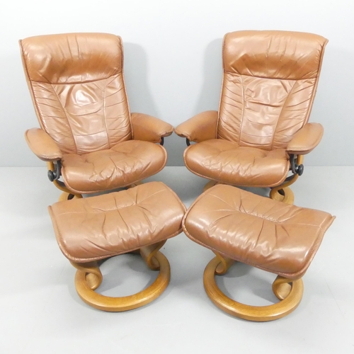 2042 - EKORNES - A pair of vintage brown leather upholstered stressless reclining swivel lounge chairs, wit... 