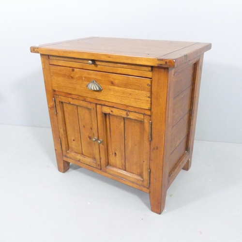 2109 - A oak two-door cabinet, with single frieze drawer and pull-out slide. 71x71x46cm.