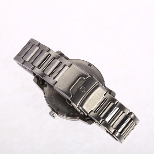 1010 - WENGER - a stainless steel Attitude quartz day/date bracelet watch, ref. 01.1541.108, black dial wit... 