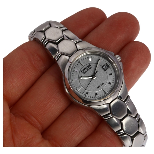 1030 - CITIZEN - a lady's stainless steel Eco-Drive WR100 quartz calendar bracelet watch, ref. E011-S065747... 