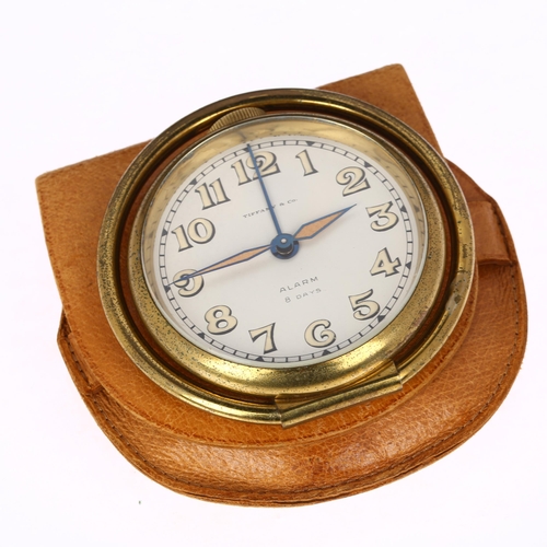 1044 - TIFFANY & CO - an Art Deco gilt-brass 8-day travelling alarm clock, by Cortland Concord Watch Co, re... 