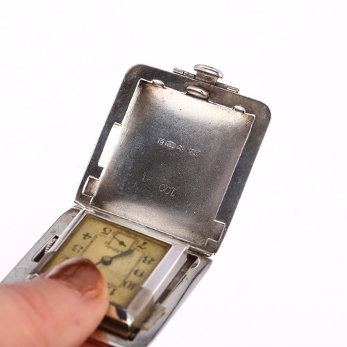 1048 - An Art Deco sterling silver travelling purse watch, circa 1930s, silvered dial with Arabic numerals,... 