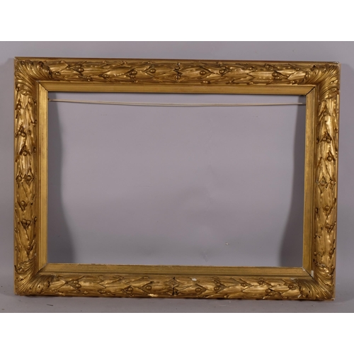 727 - Ornate 19th century gilt-gesso frame, inside measurement 51cm x 75cm