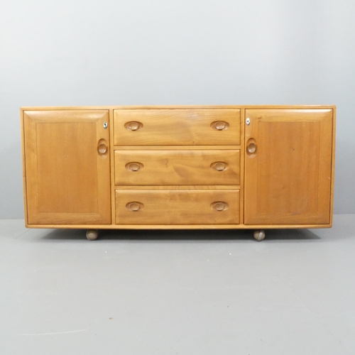 2051 - ERCOL - A model 455 Windsor sideboard, with three drawers between two cupboards and maker's mark. 15... 