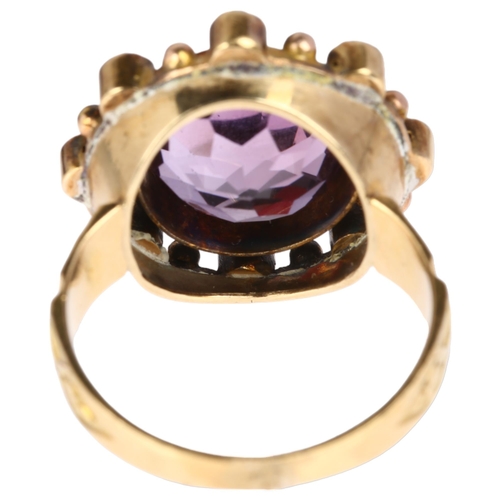 1105 - A large 19th century amethyst and pearl openwork ring, circa 1820, central rub-over set round-cut am... 