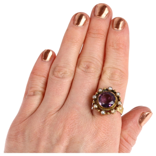 1105 - A large 19th century amethyst and pearl openwork ring, circa 1820, central rub-over set round-cut am... 