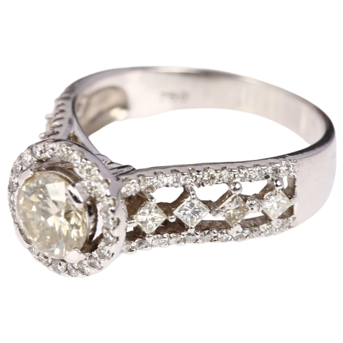 1106 - An 18ct white gold diamond halo cluster ring, maker LAO, London 2012, centrally claw set with 1.01ct... 