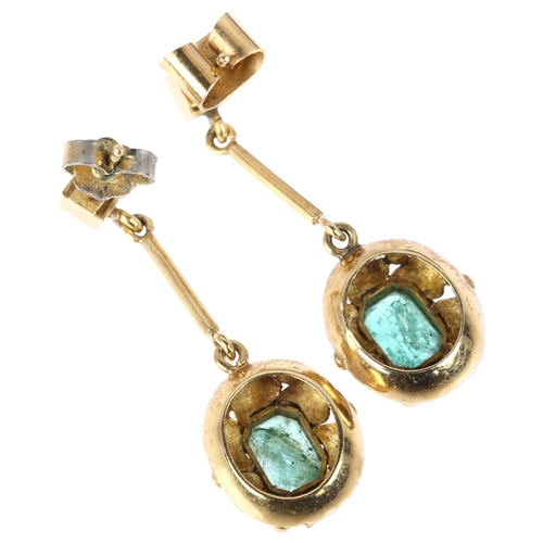 1109 - A pair of late 20th century emerald drop earrings, rub-over set with octagonal and square step-cut e... 