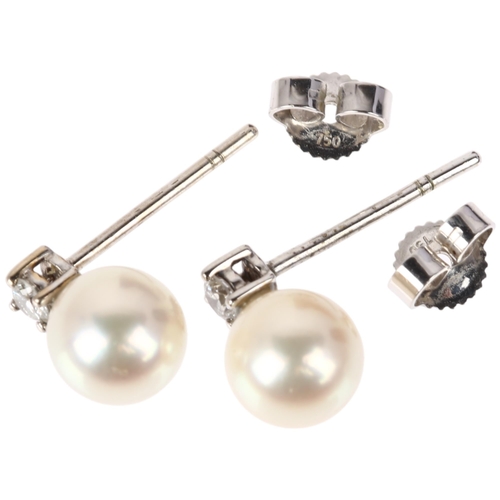 1116 - A pair of 18ct white gold whole pearl and diamond earrings, each claw set with 0.07ct modern round b... 