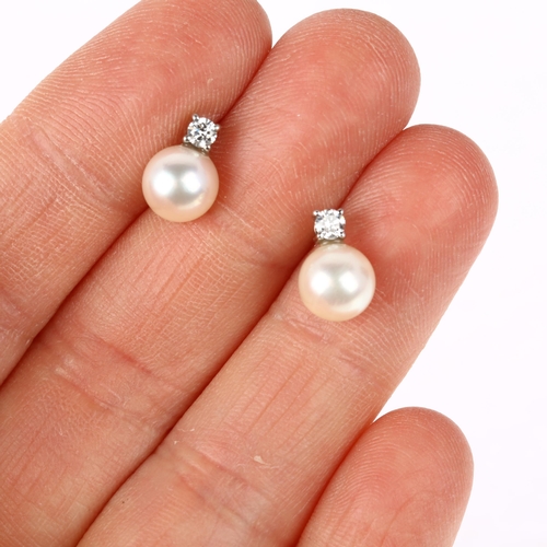 1116 - A pair of 18ct white gold whole pearl and diamond earrings, each claw set with 0.07ct modern round b... 