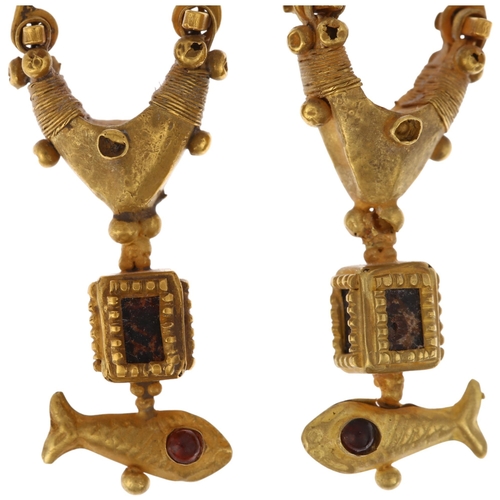 1120 - A pair of Ancient Roman style gold and garnet earrings, circa 20th century, the central loop with th... 