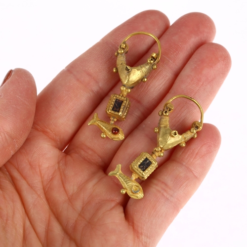 1120 - A pair of Ancient Roman style gold and garnet earrings, circa 20th century, the central loop with th... 