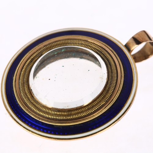 1122 - A Georgian blue and white enamel double-sided mourning locket pendant, circa 1800, circular form wit... 