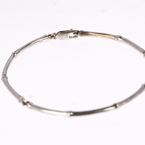 1126 - DINNY HALL - a modern 18ct white gold bamboo link bracelet, maker DHM, band width 3.3mm, 17.1g