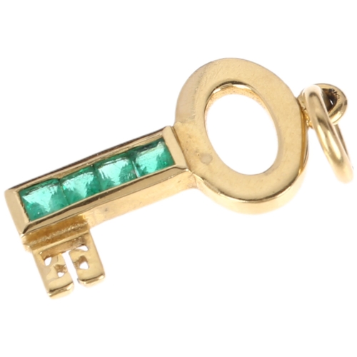 1130 - THEO FENNELL - a miniature 18ct emerald key pendant/charm, maker TF, London 2000, channel set with s... 