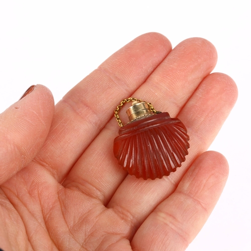 1131 - An 18th century French Regency gold-mounted miniature carnelian shell scent bottle, double-sided car... 