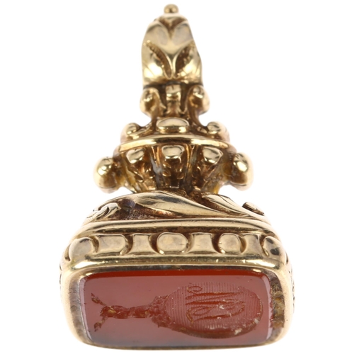 1138 - A 19th century carnelian seal fob, intaglio carved depicting hand clutching snake's crest above init... 