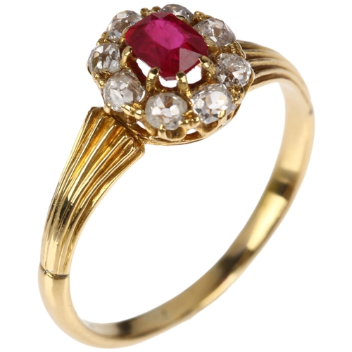 1141 - An early/mid 20th century ruby and diamond oval cluster ring, claw set with 0.35ct oval mixed-cut ru... 