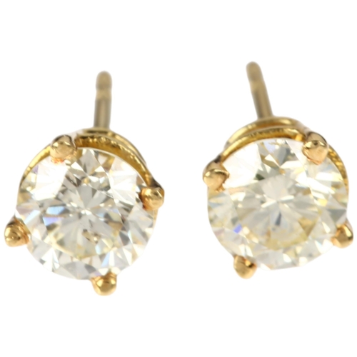 1145 - A pair of 18ct gold solitaire diamond earrings, each claw set with a 0.55ct round brilliant-cut diam... 