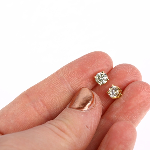 1145 - A pair of 18ct gold solitaire diamond earrings, each claw set with a 0.55ct round brilliant-cut diam... 