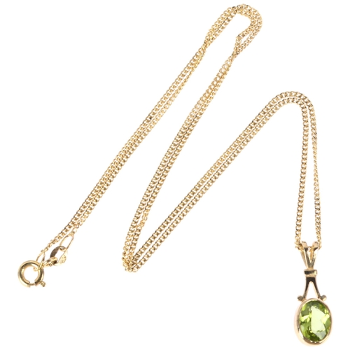 1149 - A modern 9ct gold peridot pendant necklace, rub-over set with oval mixed-cut peridot on 9ct fine cur... 