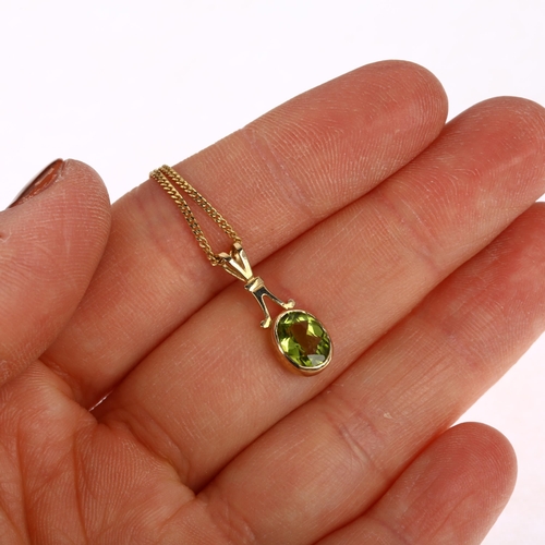 1149 - A modern 9ct gold peridot pendant necklace, rub-over set with oval mixed-cut peridot on 9ct fine cur... 