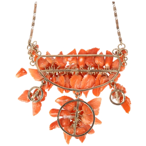 1152 - An Italian 14ct rose gold coral floral collar necklace, set with relief carved leaf flowerhead and f... 