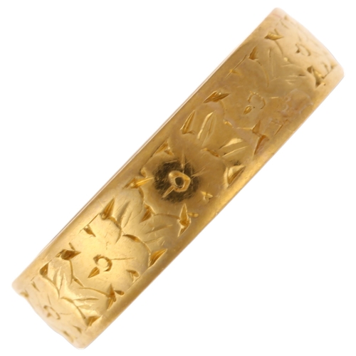 1161 - A mid-20th century 22ct gold wedding band ring, maker WW Ltd, London 1961, floral engraved decoratio... 