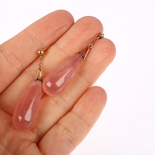 1173 - A pair of rose quartz drop earrings, each set with polished teardrop rose quartz with unmarked rose ... 