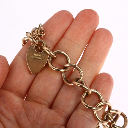 1180 - A 9ct rose gold hollow curb link charm bracelet, with later 9ct heart padlock clasp, gold 1854 USA c... 