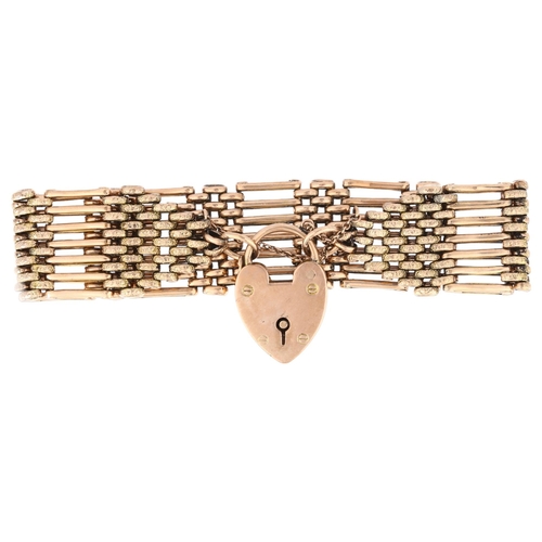 1182 - An early/mid 20th century 9ct gold gatelink bracelet, with 9ct heart padlock clasp, maker AM, 19cm, ... 