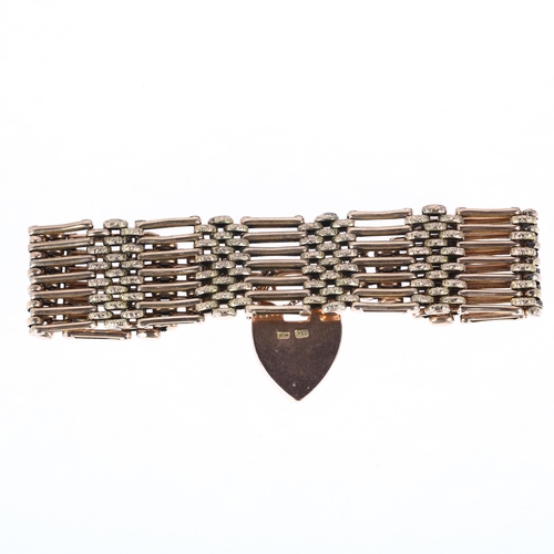 1182 - An early/mid 20th century 9ct gold gatelink bracelet, with 9ct heart padlock clasp, maker AM, 19cm, ... 