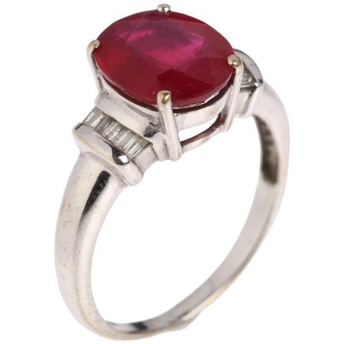 1189 - A modern 18ct white gold ruby and diamond dress ring, claw set with 2.7ct oval mixed-cut ruby flanke... 