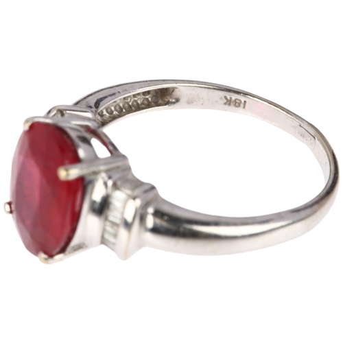 1189 - A modern 18ct white gold ruby and diamond dress ring, claw set with 2.7ct oval mixed-cut ruby flanke... 