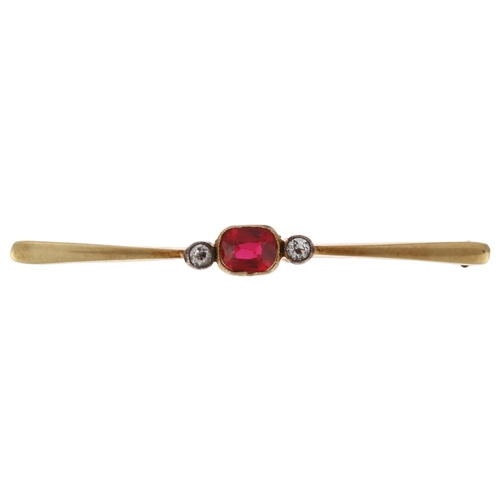 1190 - A 14ct gold three stone synthetic ruby and diamond bar brooch, rub-over set with 0.6ct oval mixed-cu... 