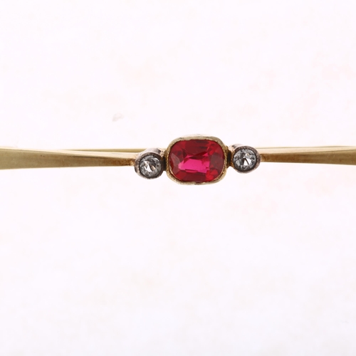 1190 - A 14ct gold three stone synthetic ruby and diamond bar brooch, rub-over set with 0.6ct oval mixed-cu... 