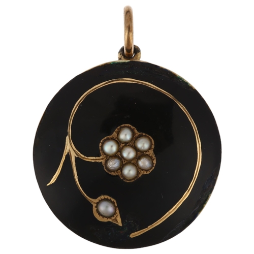 1192 - A Georgian black enamel and split pearl 'forget-me-not' mourning locket pendant, with scrolled hairw... 