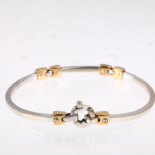 1193 - An Italian 18ct two-colour gold bangle bracelet, with screw-head motifs, band width 3mm, internal ci... 