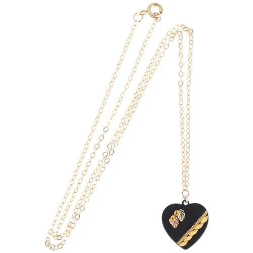 1194 - An American Black Hills 10k three-colour gold on black powder-coated metal heart pendant necklace, b... 