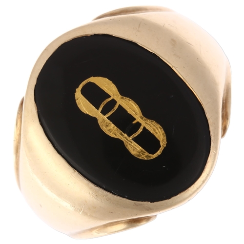 1196 - A large American 9ct gold black onyx Oddfellows signet ring, intaglio carved and gilt with insignia,... 