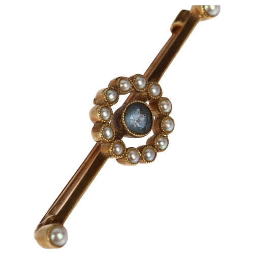 1210 - An Edwardian 15ct gold blue topaz and pearl target bar brooch, 38mm, 2.5g