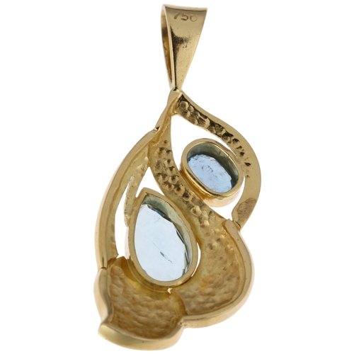 1211 - A modern 18ct gold blue topaz floral pendant, rub-over set with pear and oval-cut topaz, 42.6mm, 9.3... 