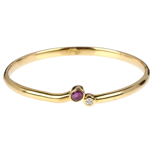 1230 - An Italian 18ct gold two stone ruby and diamond hinged bangle, maker B&C Gioielli within wings, rub-... 