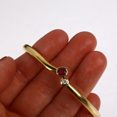 1230 - An Italian 18ct gold two stone ruby and diamond hinged bangle, maker B&C Gioielli within wings, rub-... 