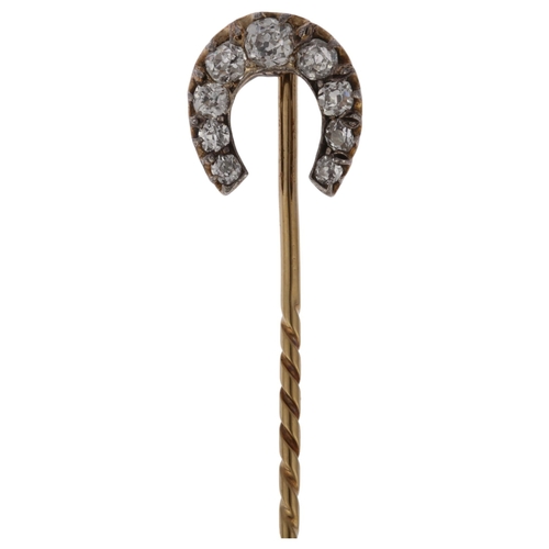 1231 - A 19th century diamond horseshoe stickpin, claw set with old-cut diamonds, total diamond content app... 